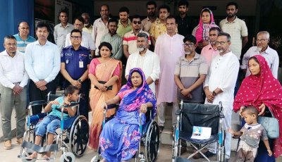 বদলগাছীতে প্রতিবন্ধিদের মাঝে হুইল চেয়ার বিতরণ